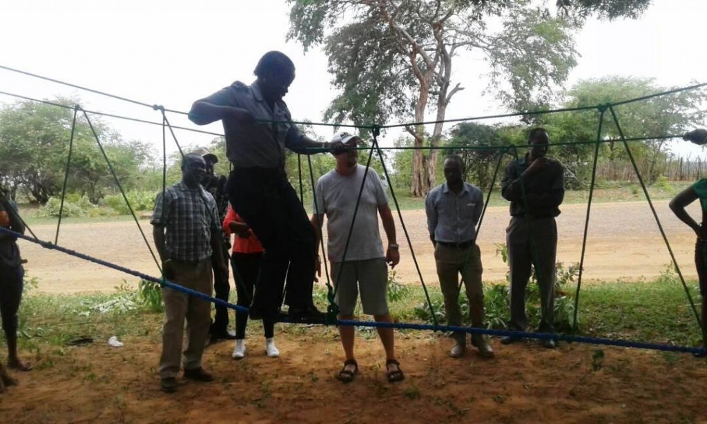 Member of  the Zimbabwe Hwange Republic Police Victim Friendly Unit (VFU) participate during the low rope course challenge 